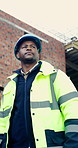Building, helmet and thinking with black man on construction site for engineering or property development. Architecture, hard hat and inspiration with industrial worker outdoor for planning or vision