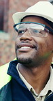 Goggles, hard hat and thinking with black man on construction site for engineering or property development. Architecture, helmet and visor with industrial worker outdoor for inspiration or planning