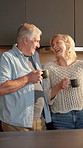 Love, couple and laugh with coffee in kitchen for funny conversation, morning gossip or bonding. Marriage, mature people and happy with beverage in home with silly humor, healthy relationship or joke