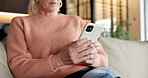 Internet, phone and hands with old woman on sofa for social media, ebook subscription and digital app. Online library, home and mature person with tech for communication and message to contact