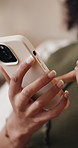 Woman, hands and scrolling with phone in home for social media, online network or connection. Closeup, female person or browsing with mobile smartphone or app for internet, news or web research