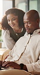 Home, black couple and talking with laptop for website info, online message and entertainment in lounge. Smile, man and woman with pc, connection or funny comment for bonding together and discussion
