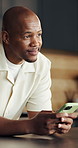 Man, thinking and browsing in home with phone, social media notification and digital chat response. Happy, black person and reflection in house with tech, online dating profile or check text message.