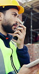 Tablet, man and radio on construction site for task brief, inspection update or conversation. Industrial, engineer or communication with tech, progress report or project coordination or feedback