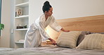 Cleaning, morning and woman making bed in home for daily routine, fresh fabric or maintenance. Change, neat and tidy with person in bedroom of apartment for chores, housework or responsibility