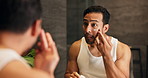 Mirror, man and cream in bathroom for skincare, grooming and skin health on morning routine. Reflection, home and person apply lotion product for facial cosmetics, beauty or dermatology benefits