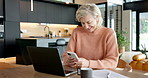 Laptop, phone and businesswoman in home with remote work for email with review on finance report. Laugh, computer and mature financial manager with cellphone for feedback on investment proposal.