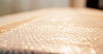 Bubble wrap, stock and shipping with box for safety, delivery and logistics for supply chain. Fragile goods, distribution and package tape for protection, plastic safeguarding or parcel cushioning