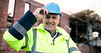 Face, architect and happy man at construction site with helmet, development or confident with ppe. Smile, engineering and mature person with arms crossed, safety hard hat and infrastructure inspector