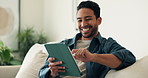 Happy, man and relax at house with tablet, social media and streaming movies for weekend break. Smile, male person and digital in home for research, download ebook and watching comedy video in lounge