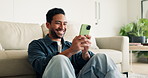 Laugh, text message or man in home with phone, online communication and comic post on social media. Happy, digital or Asian person on floor with tech, funny conversation and meme reaction on chat app
