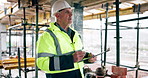 Mature, man and architect with checklist on construction site for scaffolding safety or security. Male person, contractor or civil engineer thinking with clipboard for building, PPE or architecture