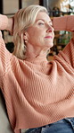 Senior, woman and relax on sofa with stretching, thinking and vision for peaceful retirement in home. Old person, rest and reflection in living room with comfortable couch, nostalgia and wellness.