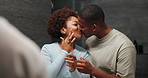 Skincare, mirror and black couple kiss in home bathroom with bonding, self care and together. Happy man, woman and reflection in house with dermatology, grooming and hygiene with lotion for glow
