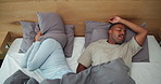 Above, frustration and couple in bed with snoring, loud sound or nasal congestion in home. Annoyed, pillow and black man with woman for nap with sleep apnea, insomnia or noise for rest in bedroom.