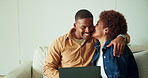 Couple, kiss and relax on couch with laptop, bonding together or check website for booking holiday. Happy, black people and affection in home with computer, relationship and reservation for vacation.