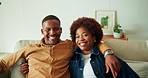 Happy couple, face and hug on couch, home and bonding with partner in lounge or connection on break. Black people, embrace and affection for spouse in living room, laughing and smile in apartment