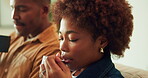 Woman, coffee and blowing in home with couple, cool drink or beverage n living room on off day. African person, partner and warm tea with calm, peace and rest on weekend break together at house