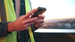 Person, hands and architect with phone in city for communication, social media or conversation. Contractor, builder or user texting with smartphone on balcony for mobile network or chatting in town