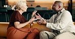 Argument, conflict or interracial couple in home, fight or relationship mistake with infidelity dispute. Disagreement, mature man and woman in living room, marriage problem or conversation on sofa