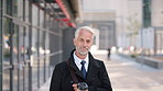 Face, commute and businessman with smile in city, legal consultant career and client representative. Portrait, professional and mature lawyer with confidence for litigation support, coffee and travel