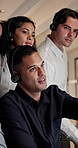 Telemarketing, man and team in office with discussion, advice or planning for lead generation at night. Late, people and talking in call center with collaboration, strategy and tips from sales agent.