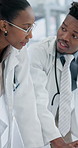 Meeting, black people and doctors at hospital in collaboration for surgery or medical treatment. Discussion, team and African healthcare workers with schedule planning together for service in clinic.