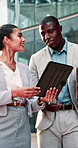 Meeting, team and business people on tablet in city for finance proposal, planning and report. Corporate, happy and woman with man on tech for talking, feedback and collaboration for financial review