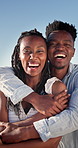 Couple, face and happy on holiday, hug and travel with partner for anniversary celebration and date. Outdoor, black people and embrace with spouse on special event, bonding and support on vacation