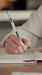 Creative, writing and hand with notebook in home, remote work and plan for story development on desk. Freelance, author and person with notepad, brainstorming and novel ideas with notes in house