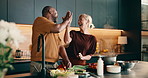 High five, cooking and interracial couple in home with support, love and meal prep with healthy food in kitchen. Mature, man and woman with celebration for recipe, smile and culinary skills for diet