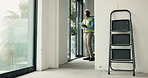 Electrician, building and black man with tablet for inspection, safety check or maintenance on site. Male person, technician or security with technology or helmet for PPE or electrical installation