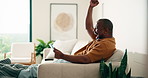 Man, celebration and watching sports with tablet for soccer match, goal or competition success in home. Mature, black person and cheering on couch with tech, football broadcast and excited for win.