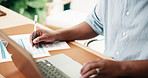 Man, hands and writing with laptop for finance, budget planning or tax deduction in office. Male person, accounting or checklist with paperwork, documents or computer for financial audit in workplace