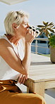 Home, woman and relax with coffee on balcony for calm morning, sun basking and weekend break. Thinking, mature person and drinking beverage outdoor at house for fresh air, start day and peaceful view