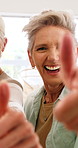 Laugh, face and women with thumbs up selfie for great holiday, reunion success or online post. Happy, mature friends and yes emoji in home for weekend approval, social bonding memory or status update