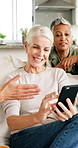 Phone, friends and mature women in home for social media, conversation or past memory with happiness. Mobile, group and people at house together for talking, share news and show post for nostalgia