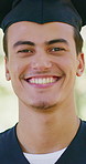 Graduation, face or man in park with smile, college pride or optimism in academic achievement. Education, happy or university student outdoor with portrait, confidence or success in farewell ceremony