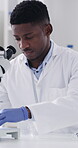 Syringe, black man and scientist in laboratory with research for medical innovation with beaker. Sample, person and chemist with liquid solution for pharmaceutical development with clinic results.