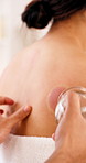 Cupping therapy, back and people in spa with glass, pain relief or detox in alternative medicine. Holistic, client or wellness therapist with mark, lymphatic drainage or muscle recovery in center.
