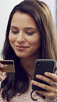 Phone, banking and happy woman with credit card in home for payment, online shopping or purchase. Female person, shopper or smile with debit or mobile smartphone for ecommerce or wireless transaction