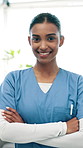 Face, nurse or happy woman with confidence for healthcare aid, medical service or advice. Portrait, female person or health worker with smile or arms crossed for medicare volunteering in nursing home