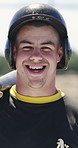 Face, man and baseball player with smile for sports, fitness and confidence for competition outdoor. Portrait, batter and professional athlete with helmet for safety, happy person or game training