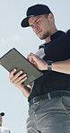 Baseball, coach and tablet with man outdoor for game strategy, match tactics or planning. App, below and competition research with person at sports venue for digital review of tournament results
