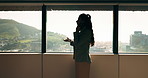 Woman, phone call and discussion at window in office with profile, contact and advice at insurance company. Person, broker or explain at glass for career, review or feedback at risk management agency