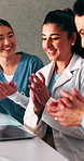Laptop, doctors or people with applause in clinic for clear lab results, surgery approval or success. Excited, medical team and tech with clapping for organ donor match, breakthrough and celebration