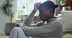 Black woman, stress and fear in home for mistake, overthinking or loss with pressure or phobia. Trauma, panic or female person with depression in living room with anxiety for mental health crisis