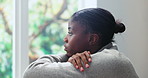 Black woman, window and overthinking in home for mistake, anxiety or fear with pressure or phobia. Trauma, panic or female person with depression in living room with stress for mental health crisis