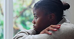 Black woman, window and anxiety in home for mistake, overthinking or fear with pressure or phobia. Trauma, panic or female person with depression in living room with stress for mental health crisis