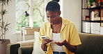 Confused, woman and surprise in home with phone, unexpected news and text message for online gossip. Black person, concern and shock in house with tech, mobile chat and typing for social media rumor.